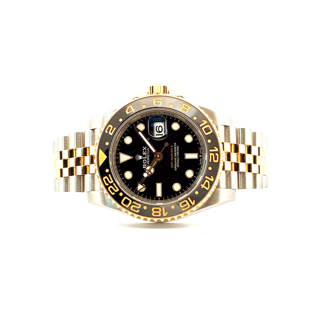 Rolex GMT-Master II Stahl/Gelbgold Frontansicht mit schwarzem Zifferblatt und Keramik Lünette