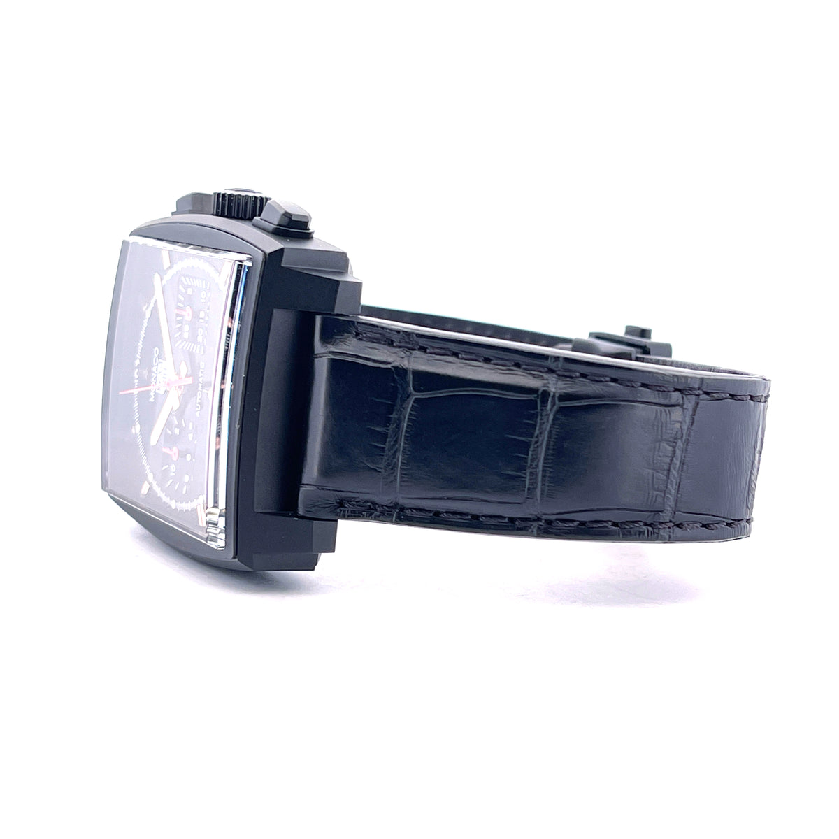 Tag Heuer Monaco "Dark Lord" Titan / Service 2026 / very good Condition / 20cm wrist size, Seitenansicht mit Armband, Krone und Drückern vor weißem Hintergrund