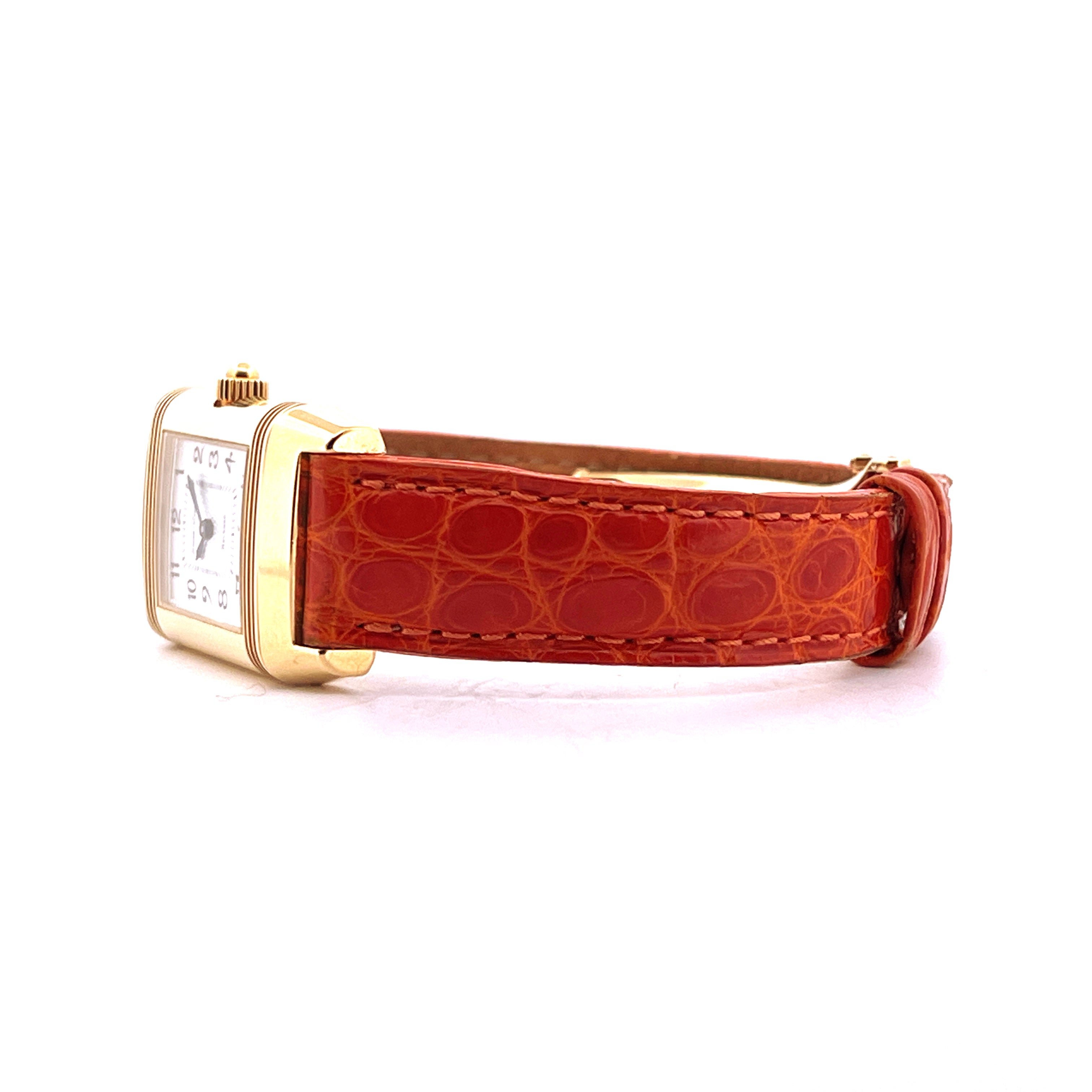 Jaeger-LeCoultre Reverso Duetto aus Gelbgold, Seitenansicht mit oranges Lederarmband