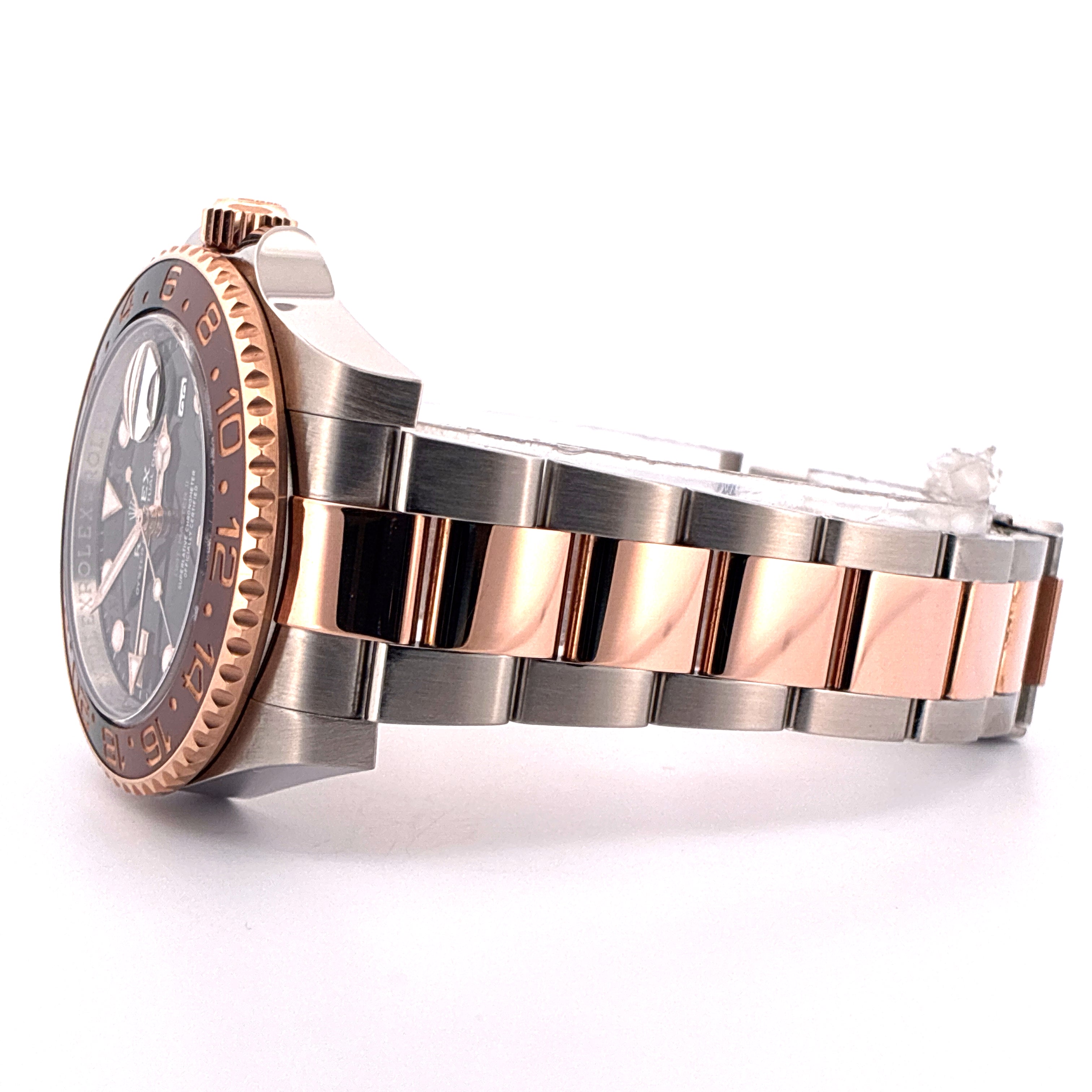 Rolex Rootbeer Stahl-Gold Automatik mit brauner Lünette von der Seite fotografiert