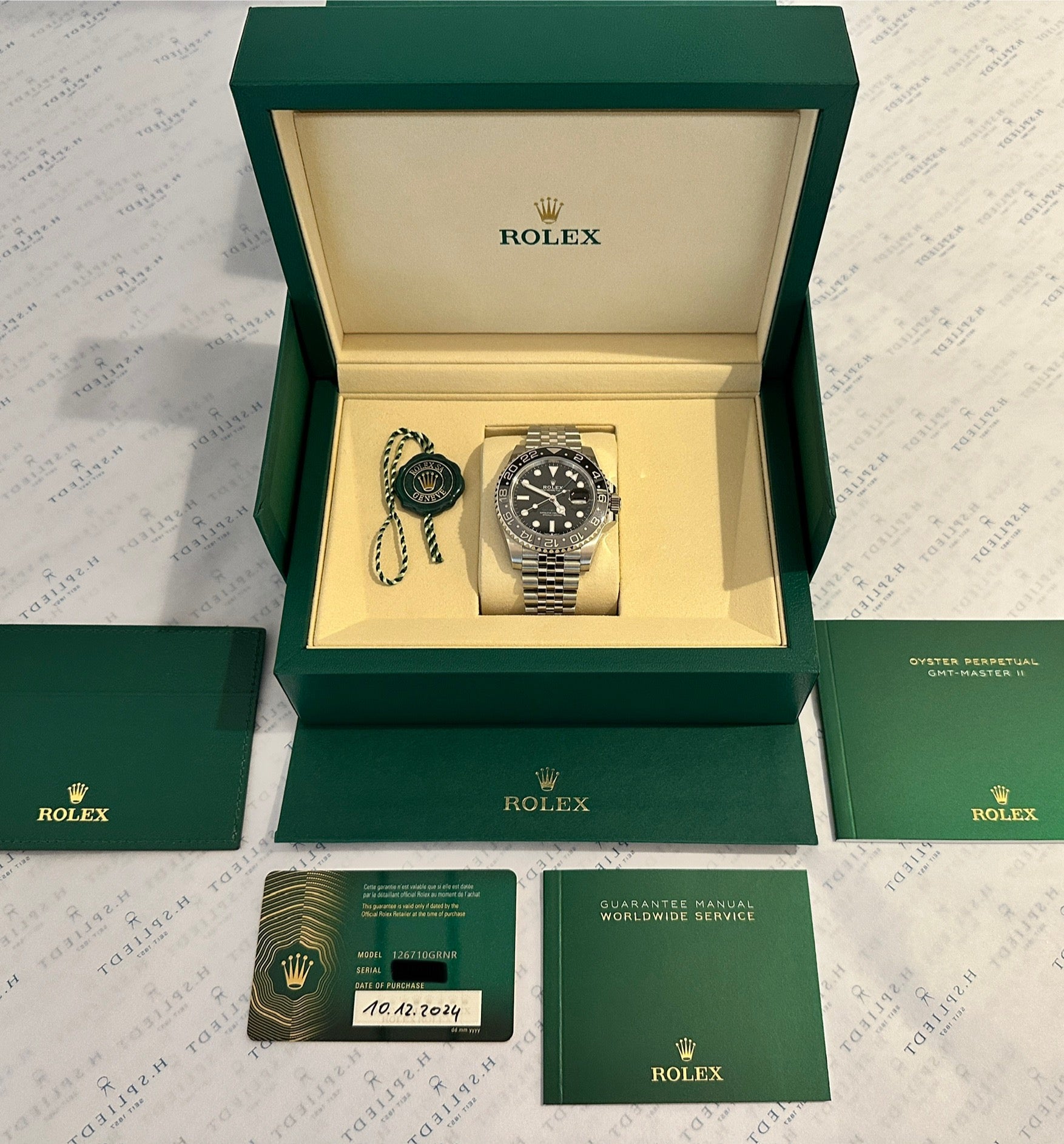 Rolex GMT-Master II "Bruce Wayne" Edelstahl Automatik im geöffneten Karton mit Papieren und Etiketten
