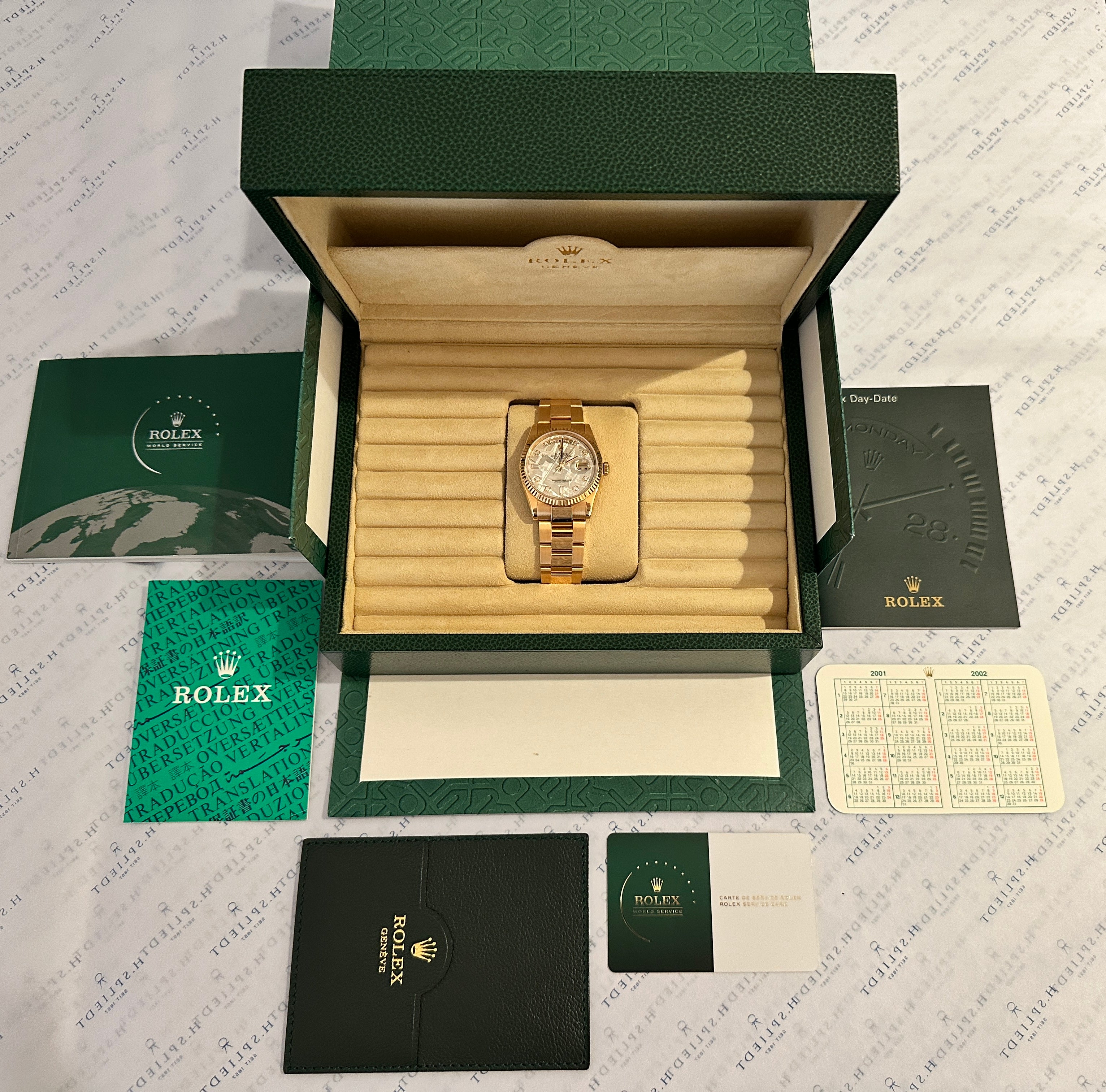 Rolex Day-Date 36 Meteorit Roségold (2001) im geöffneten Karton mit Papieren