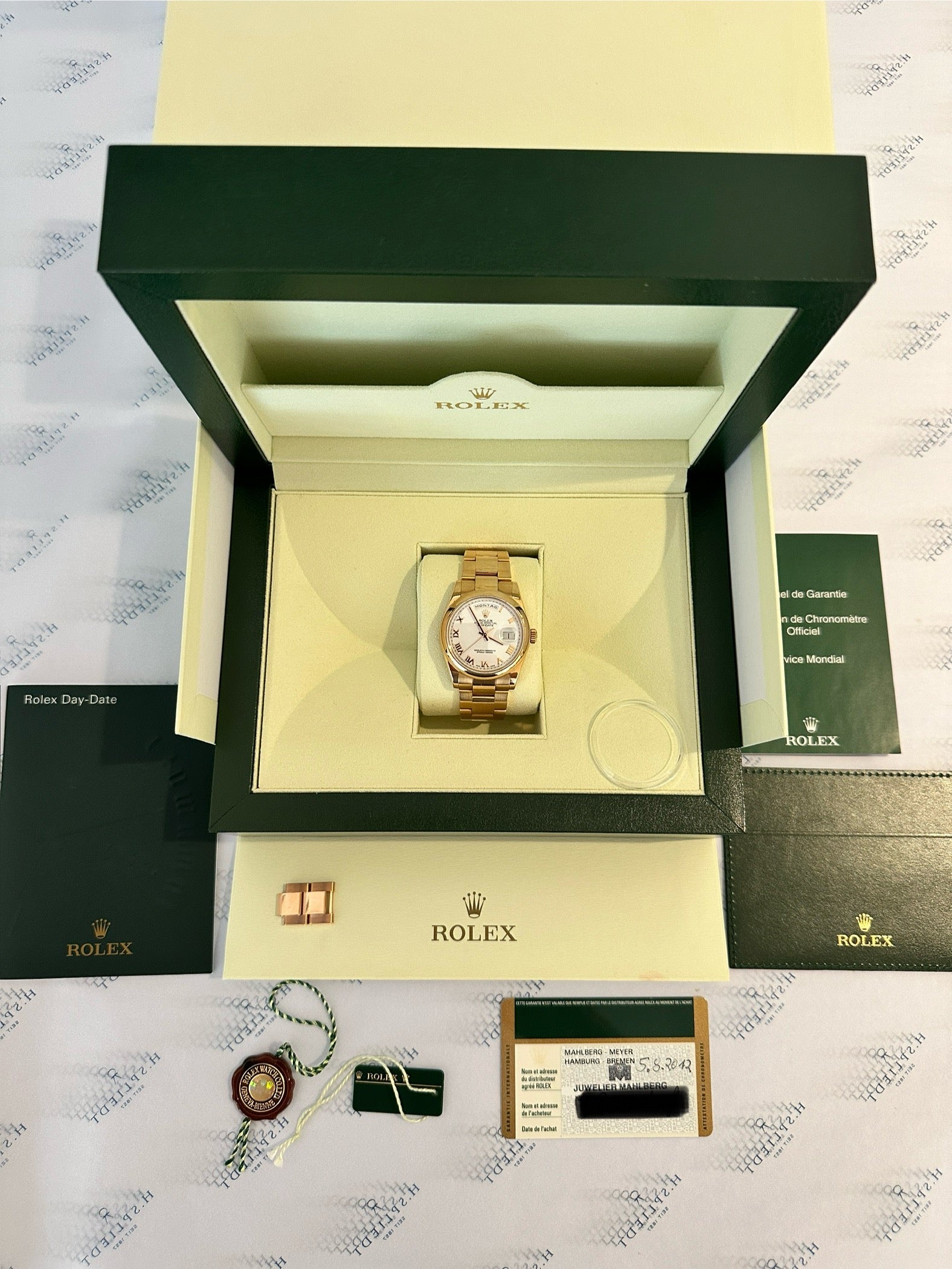 Rolex Day-Date 36 Roségold in der geöffneten originalen Box mit Papieren