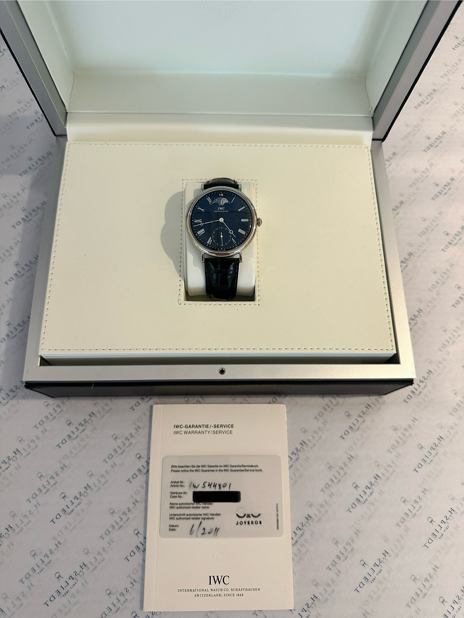 IWC Portofino Moonphase Edelstahl mit Mondphase im geöffneten Karton mit Papieren