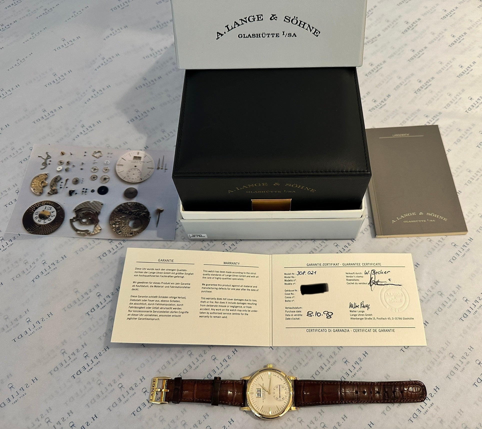 A. Lange & Söhne Langematik in Gelbgold mit braunem Lederband und Garantiekarte