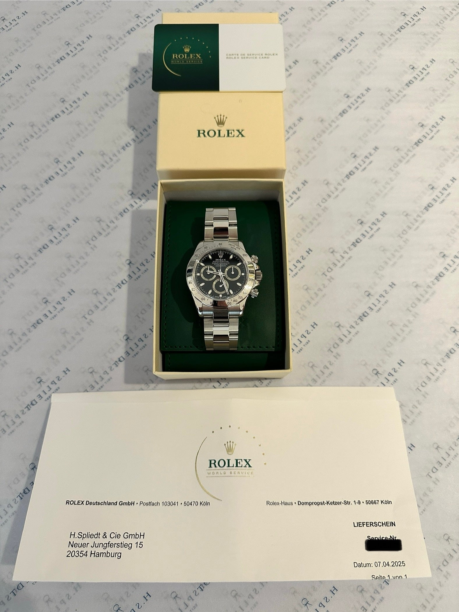 Rolex Daytona 116520 im geöffneten Servicekarton mit Servicekarte und Lieferschein