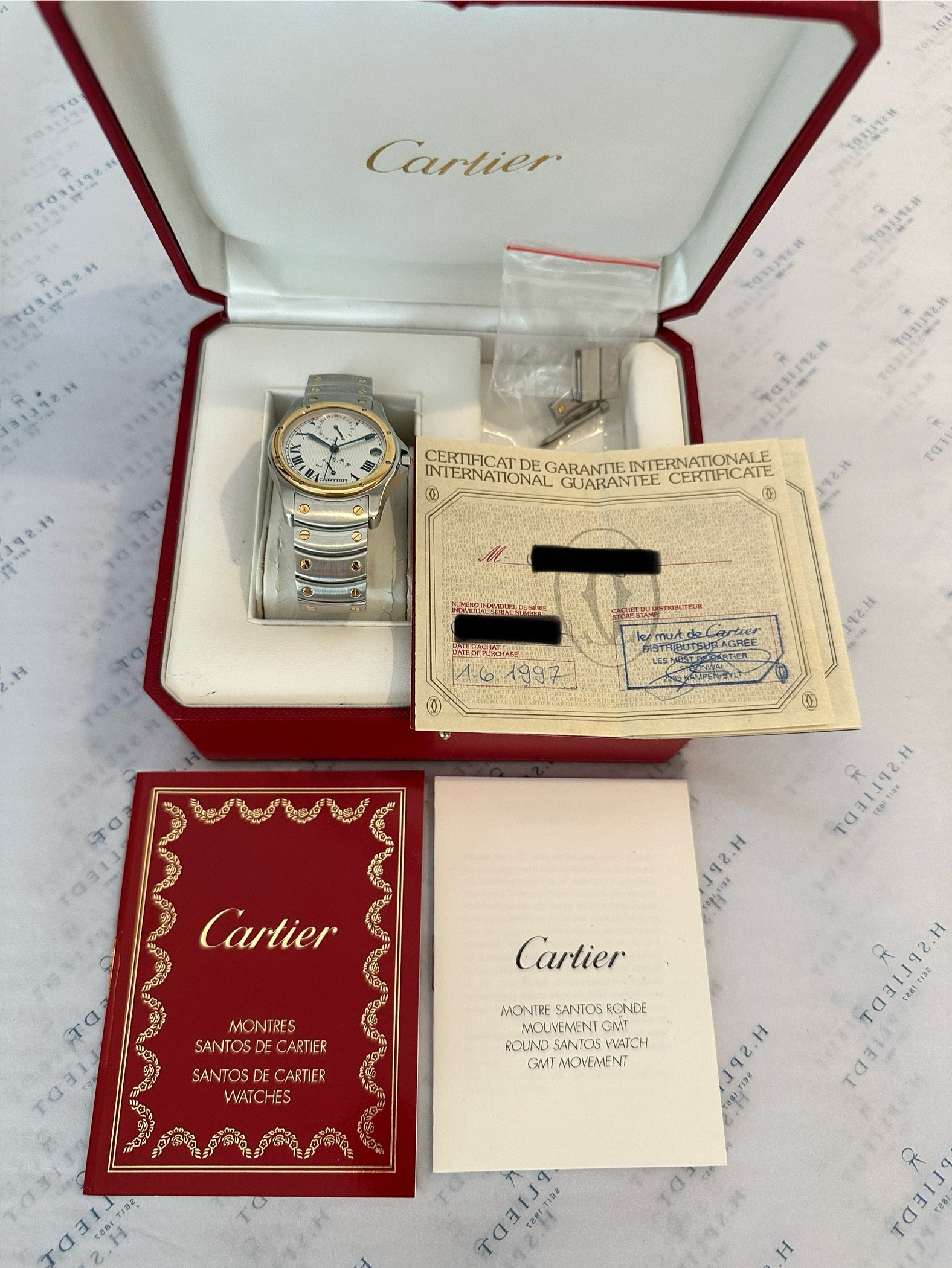 Cartier Santos Ronde 150th Automatic (1997) im geöffneten roten Etui mit Zertifikat und Anleitung