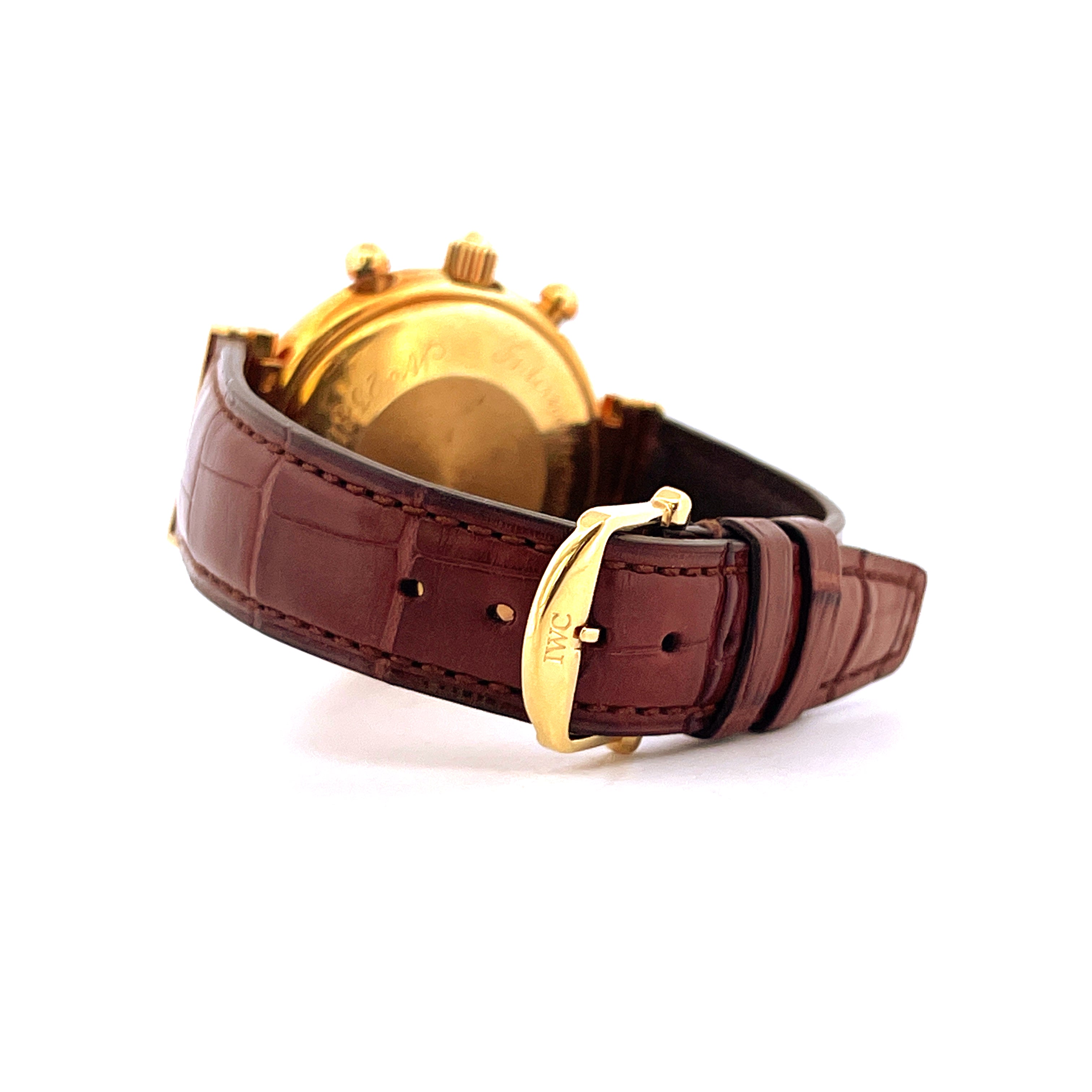 Seitenansicht einer IWC Da Vinci Perpetual Calendar 1987 aus Gelbgold mit braunem Lederarmband und Goldschließe