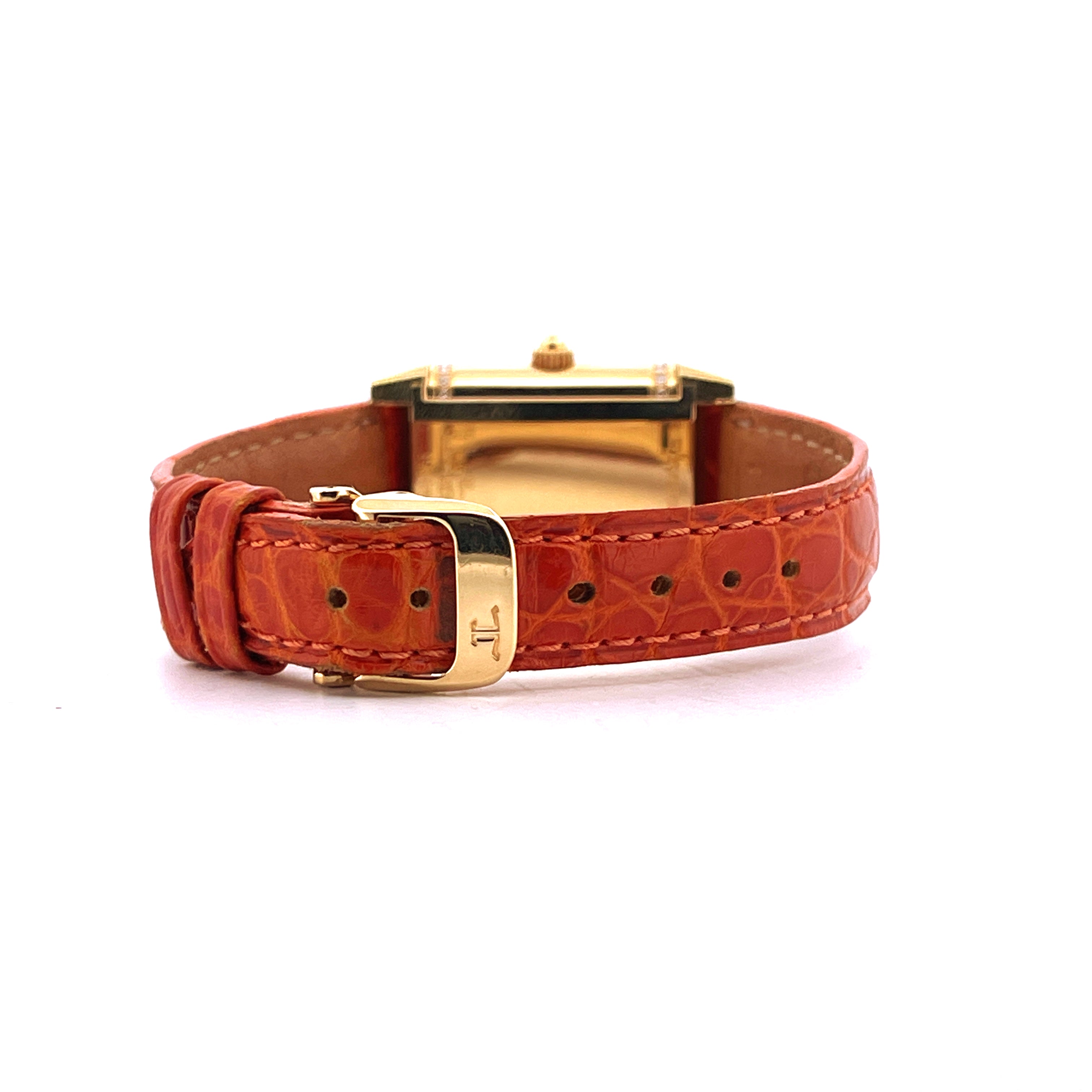 Seitenansicht einer Jaeger-LeCoultre Reverso Duetto aus Gelbgold mit orangefarbenem Lederarmband und Dornschließe