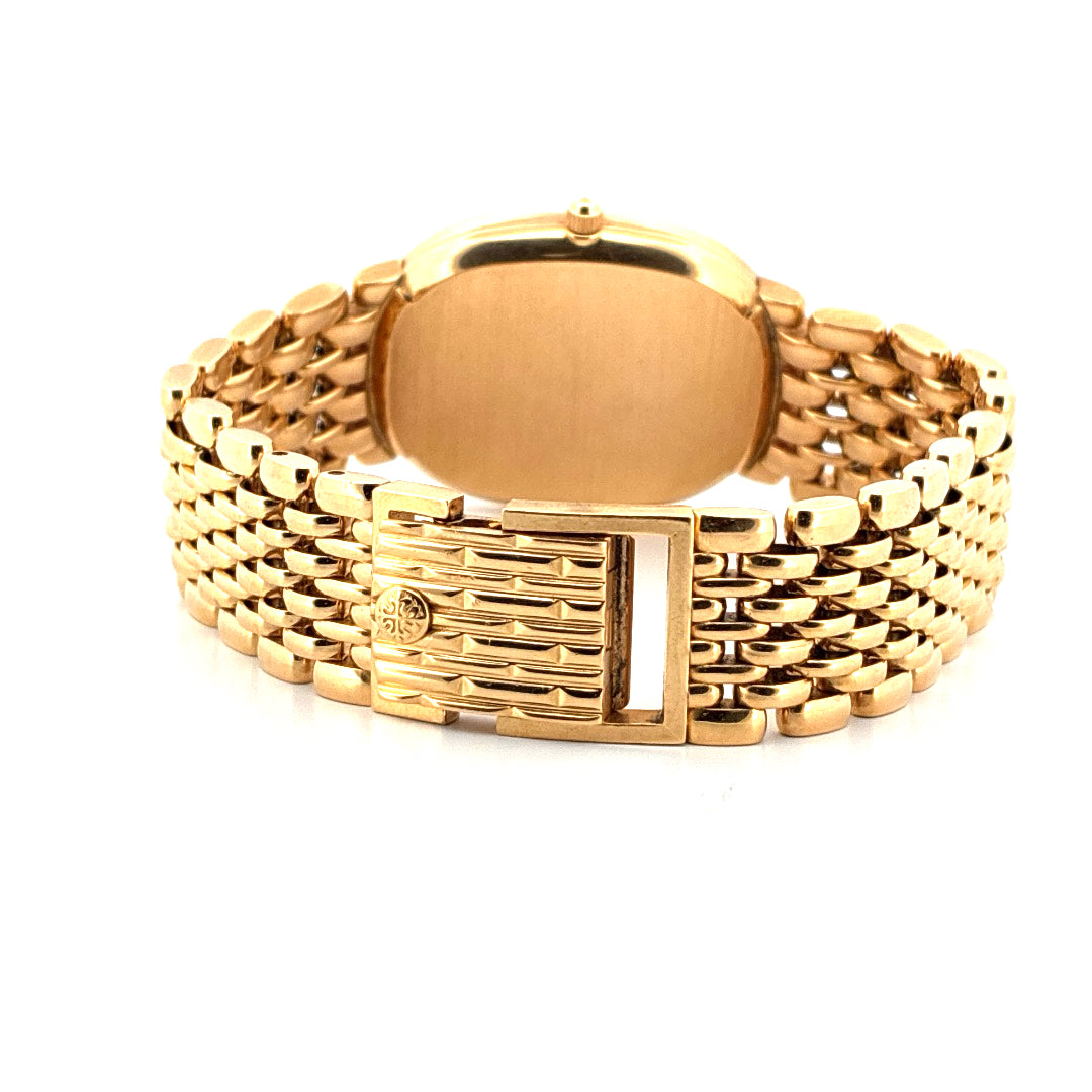 Patek Philippe Ellipse d'Or aus Gelbgold von hinten mit gestreiftem Armband und Faltschliesse