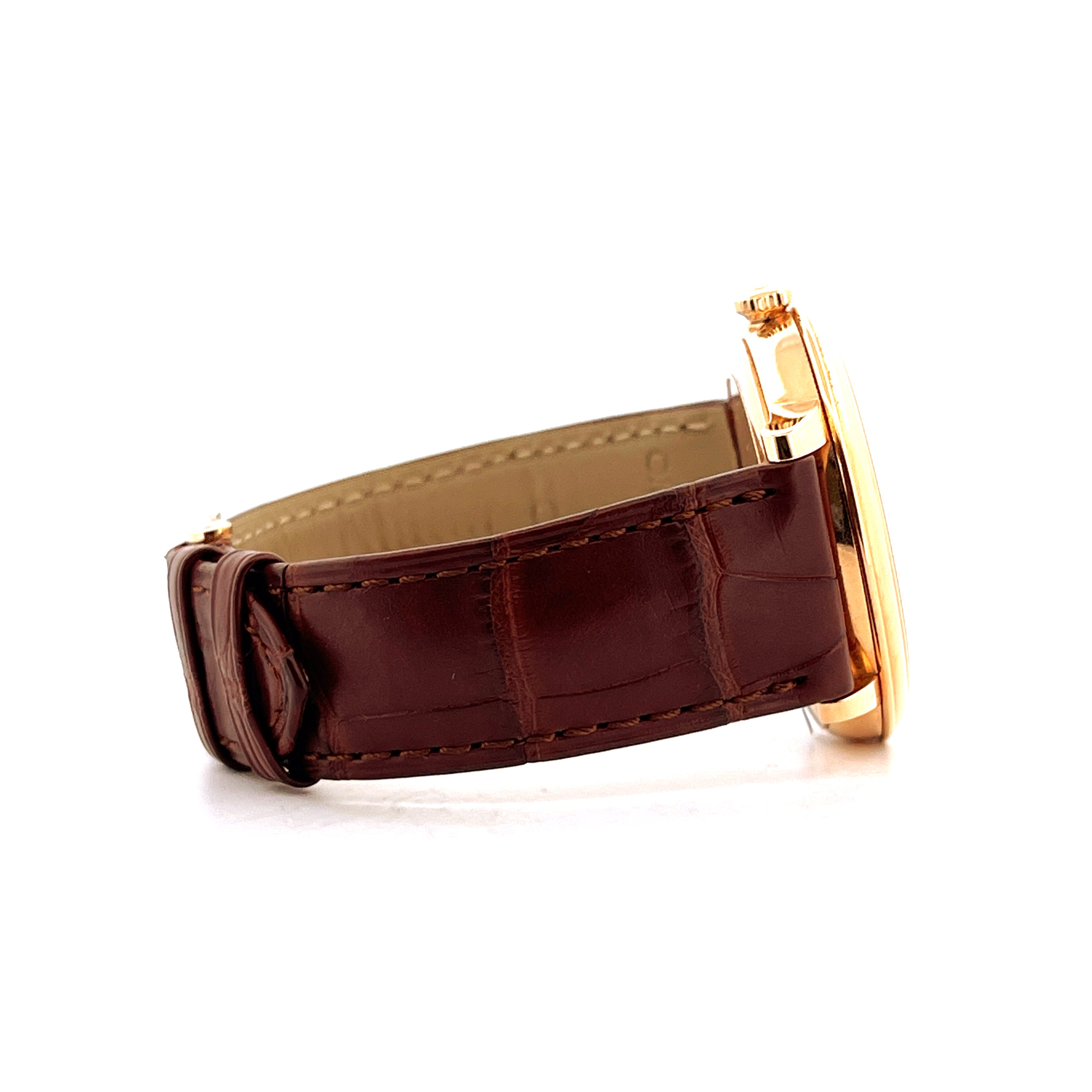 Seitenansicht einer Omega De Ville Prestige Date Uhr mit braunem Krokolederarmband und Gelbgoldgehäuse
