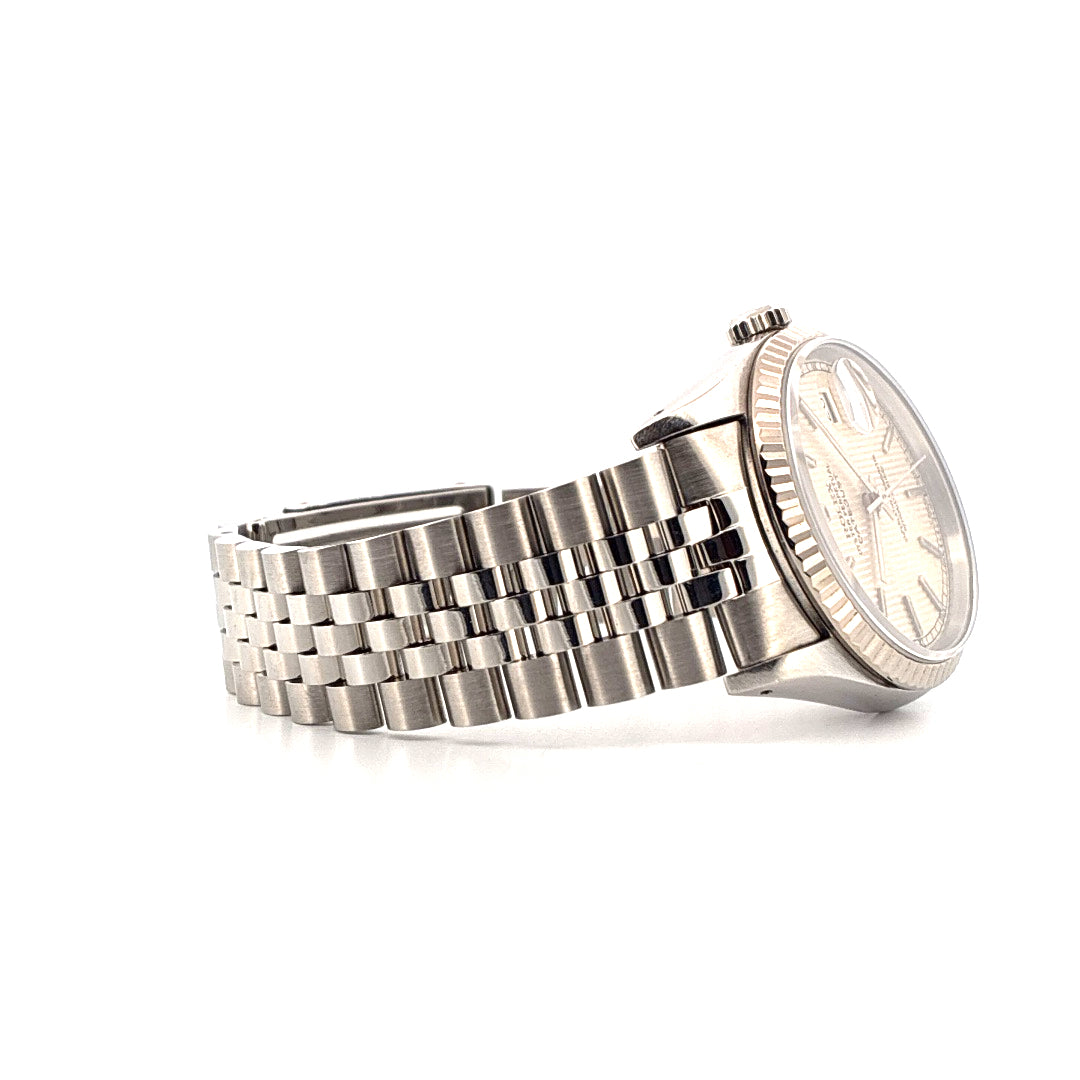 Side view of a Rolex Datejust 36 steel watch with a silver dial and fluted bezel