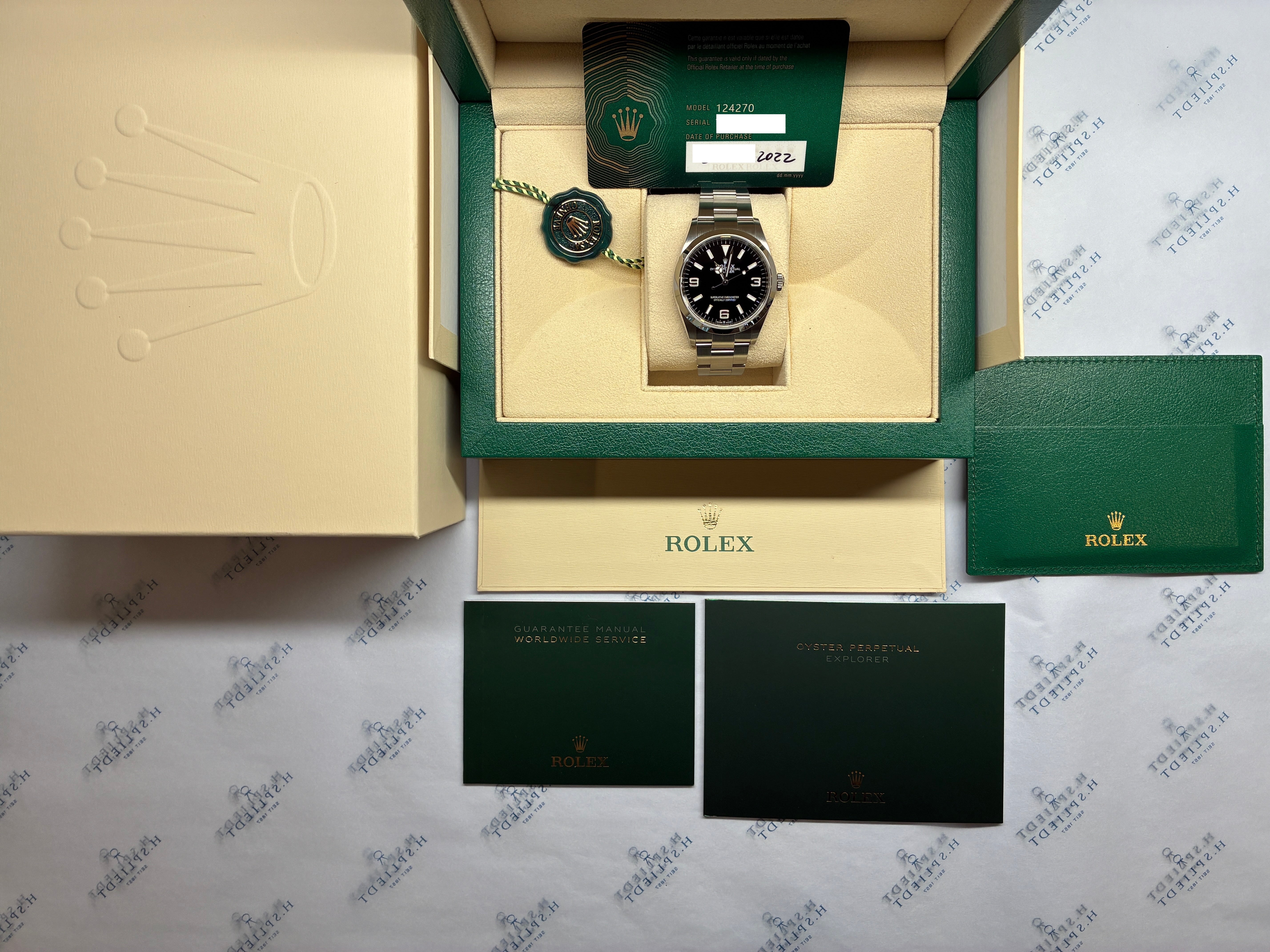 Rolex Explorer Automatik in Stahl mit schwarzem Zifferblatt in einer grünen Box mit Papieren und Siegel, Modell 124270, Kaufdatum 2022