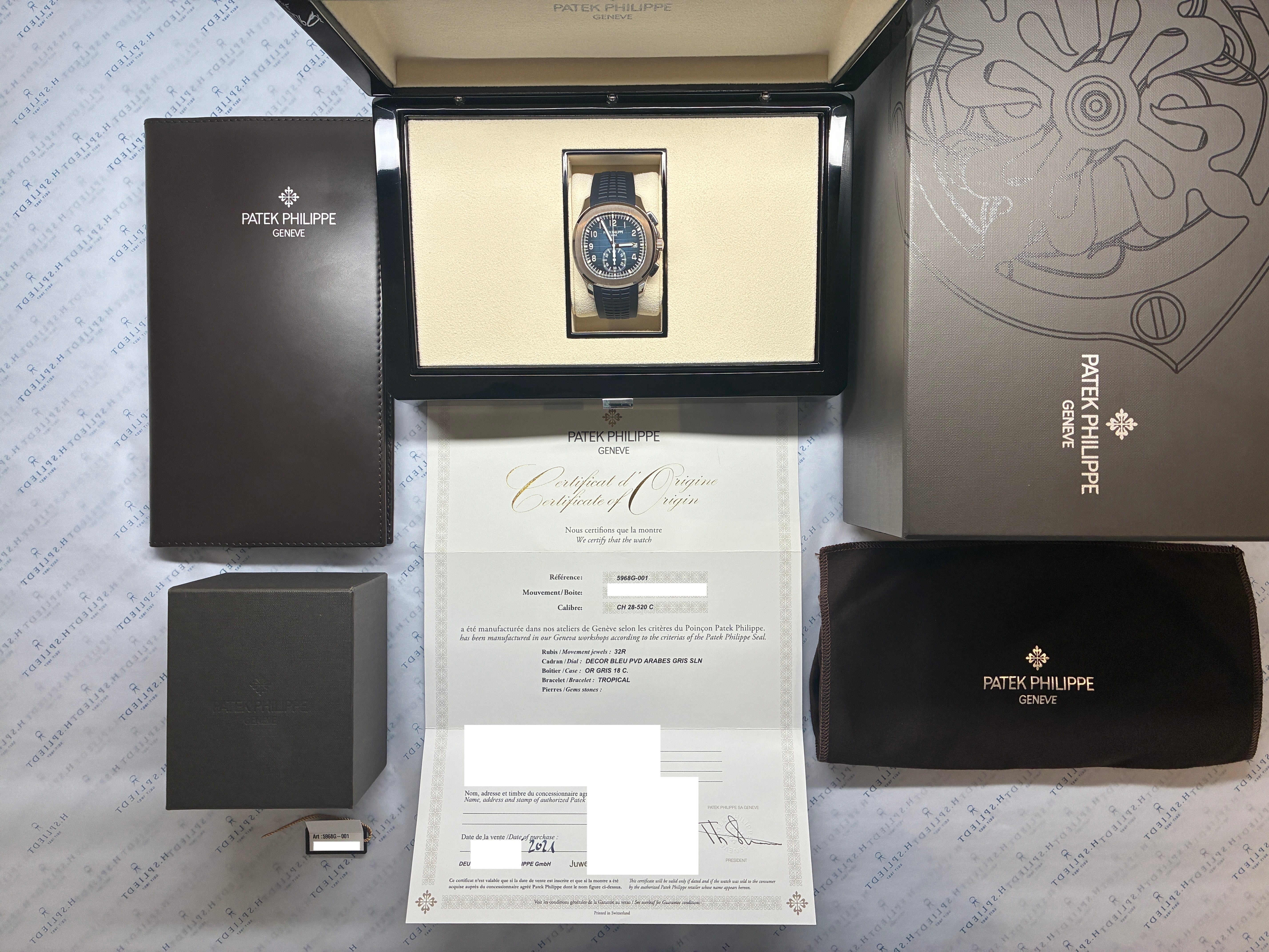 Patek Philippe Aquanaut Chronograph in sehr gutem Zustand mit blauem Zifferblatt und weißgoldenem Gehäuse im Full-Set, aus dem Jahr 2021