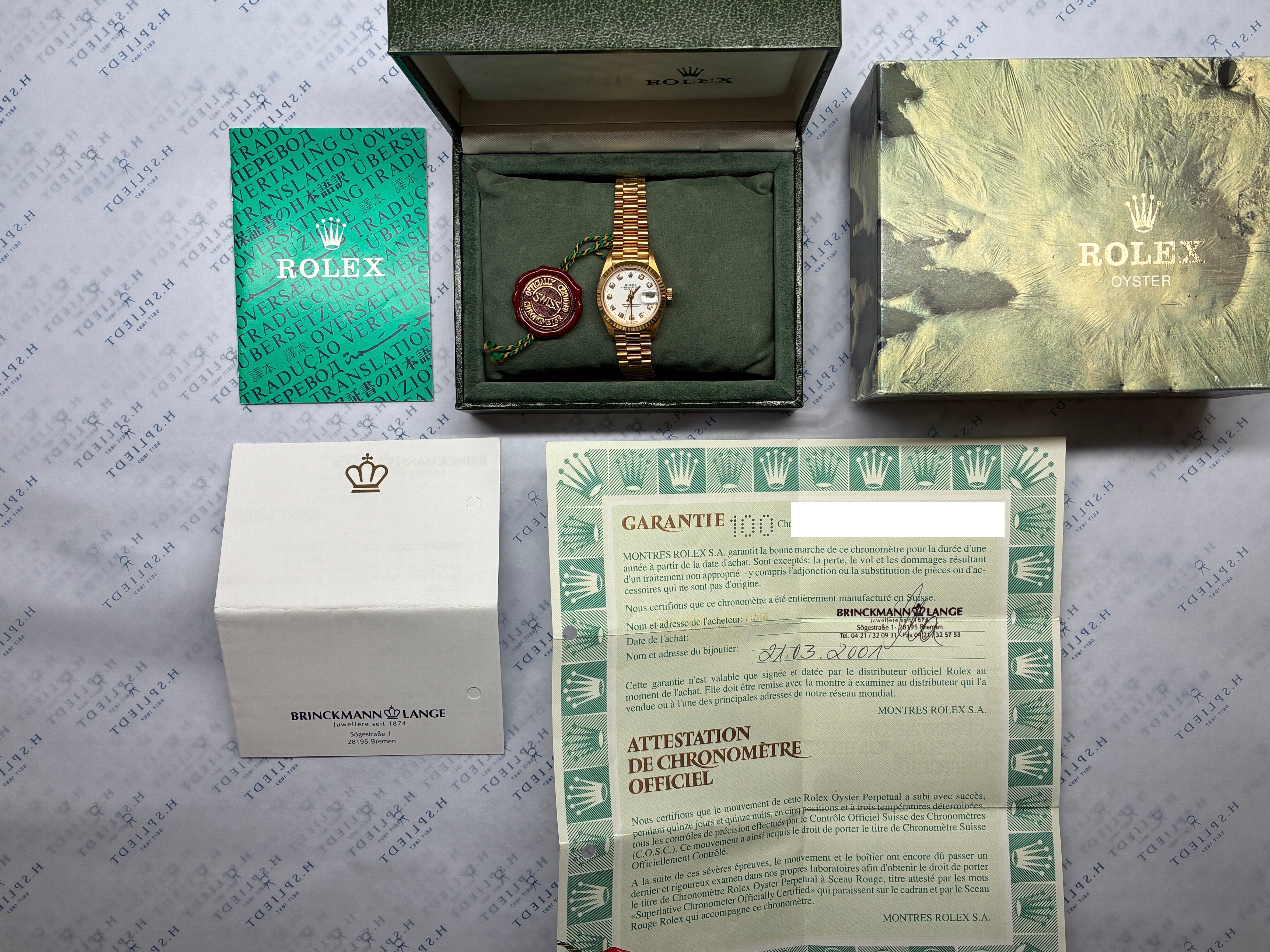 Rolex Lady-Datejust in Gold mit Garantiekarte, Box und Siegel in Nahaufnahme