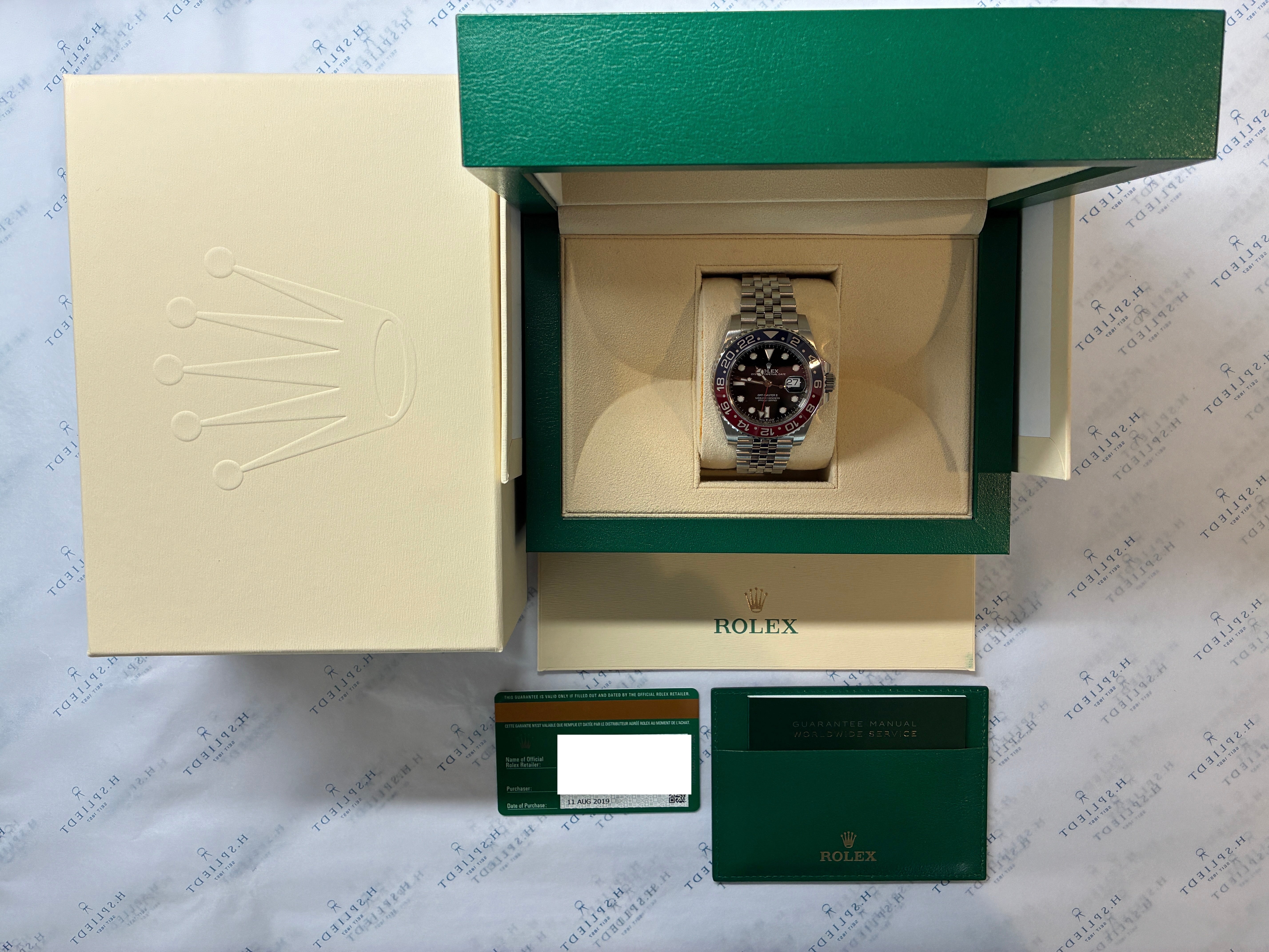 Rolex GMT-Master II Pepsi Jubilee aus Edelstahl 2019 in geöffneter Box mit Papieren
