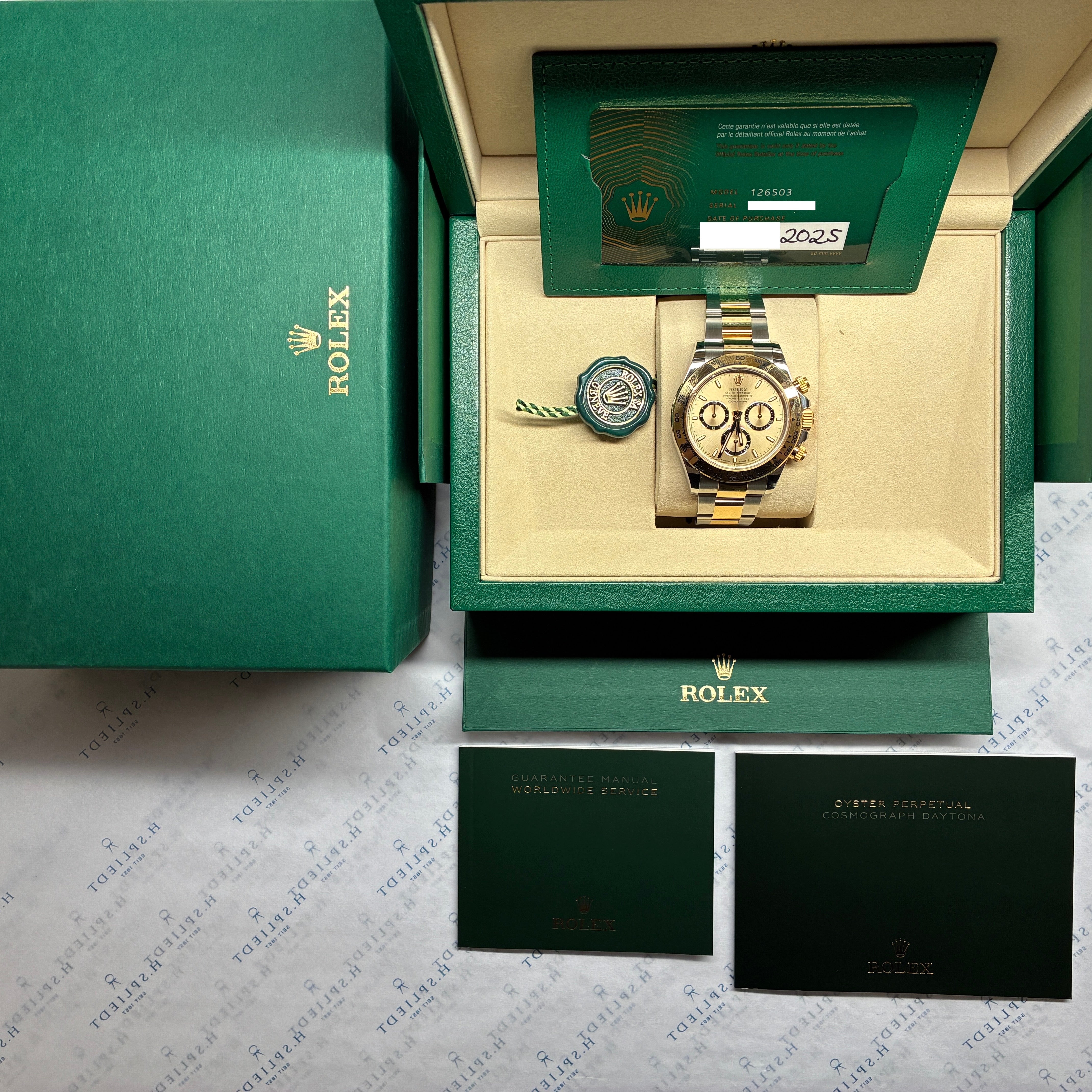 Rolex Daytona Full-Set aus Stahl und Gold mit einem goldenen Zifferblatt, in originaler Verpackung