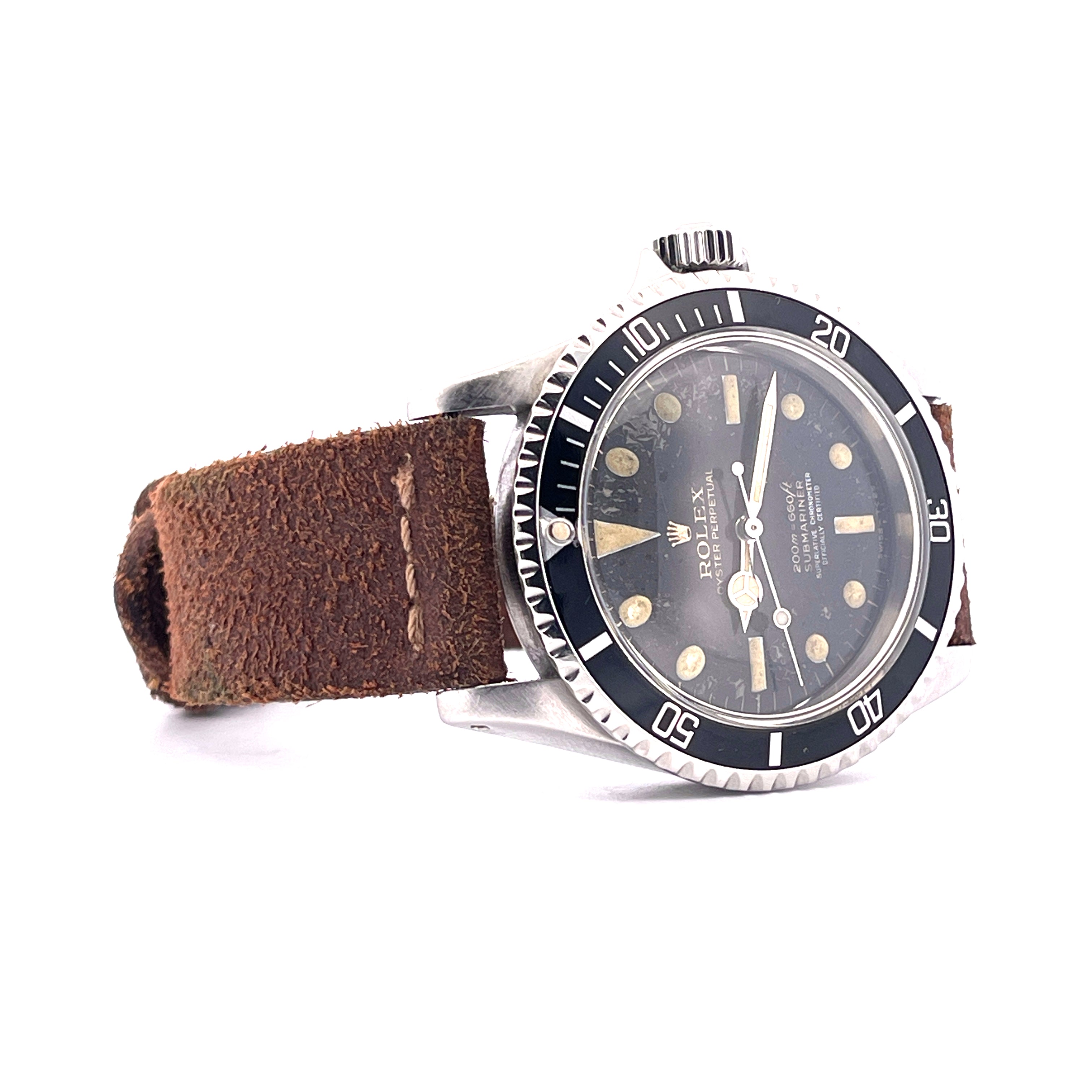 Rolex Submariner Ref. 5512 von 1963 mit Stahlgehäuse, schwarzem Zifferblatt und braunem Lederarmband