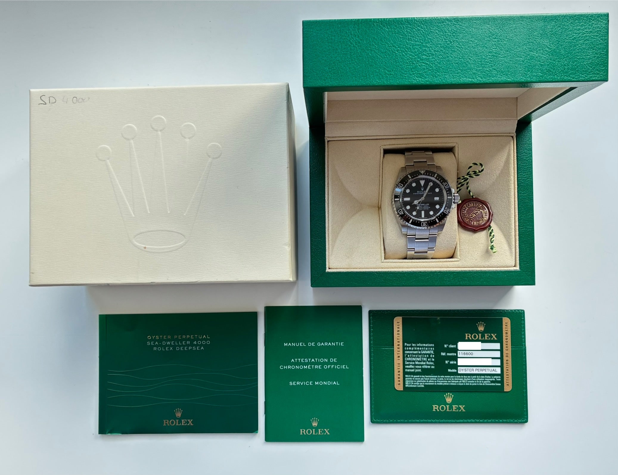 Rolex Sea-Dweller 4000 (2014) im geöffneten Karton mit Papieren und Zertifikat