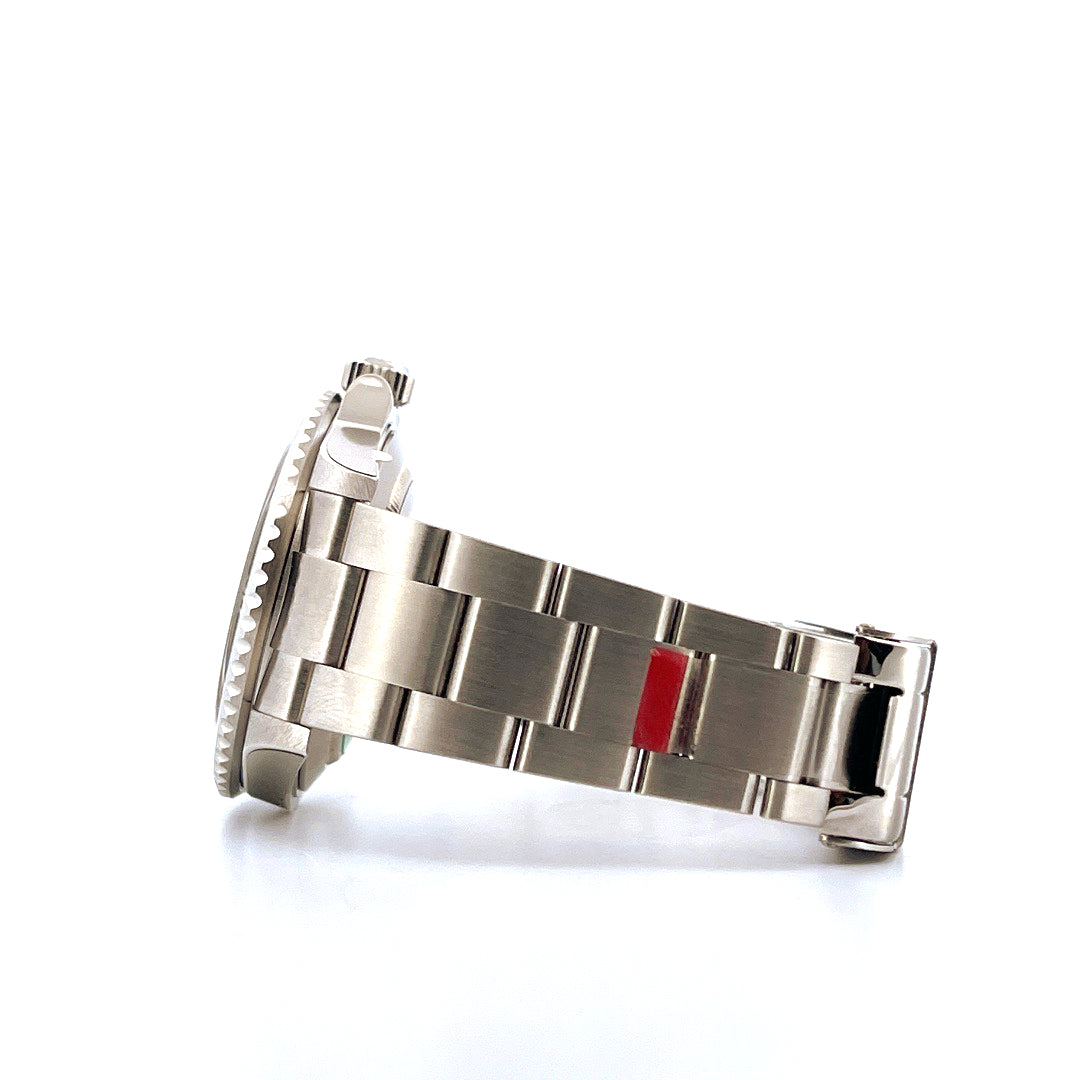 Side view of a Rolex Submariner Date "Kermit" watch with a steel bracelet featuring a red stripe
