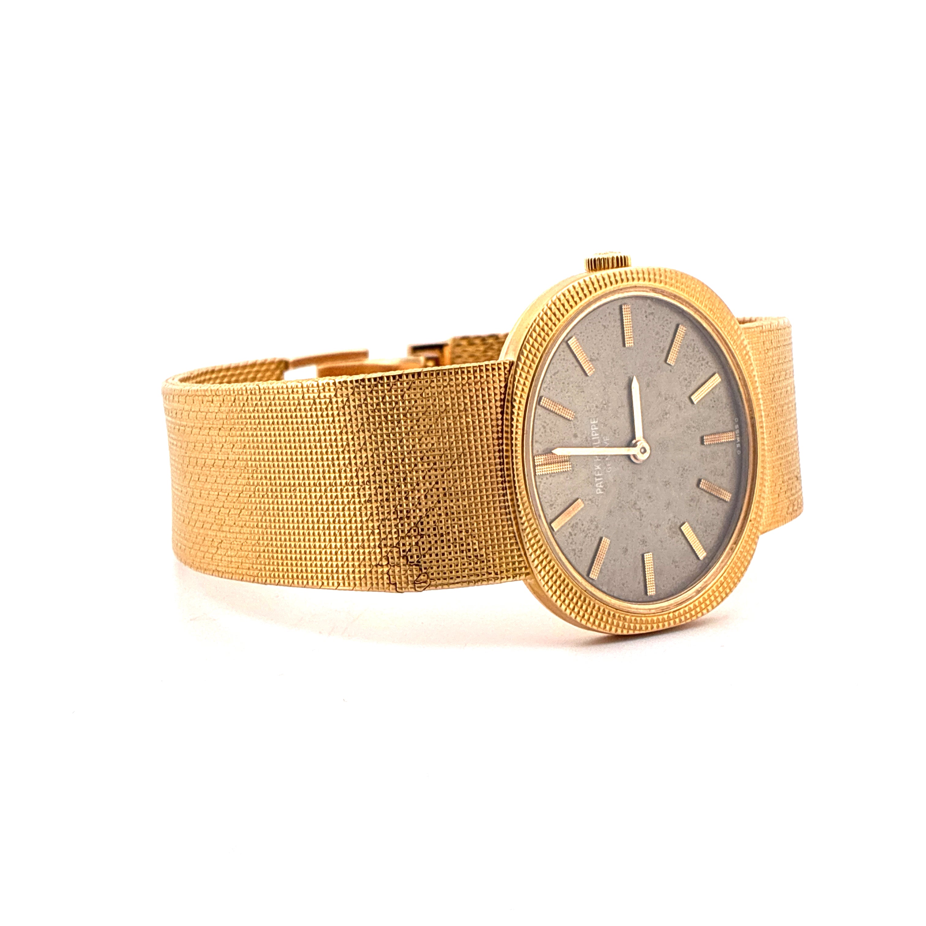 Patek Philippe Ellipse d'Or aus Gelbgold mit grauem Zifferblatt und feinem Milanaise-Armband