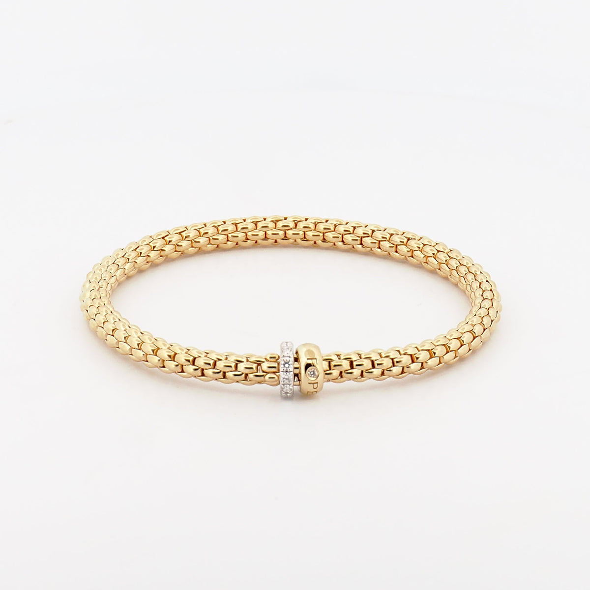 Flexibles Armband komplett aus 18K  Gelbgold mit zwei rondellen