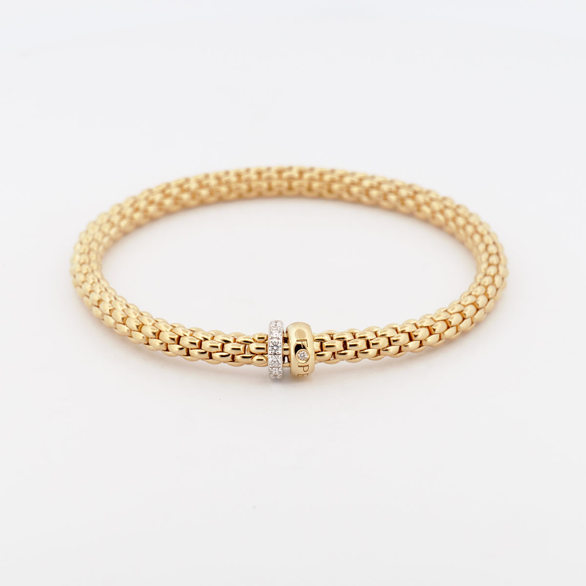 Flexibles Armband komplett aus 18K  Gelbgold mit zwei rondellen